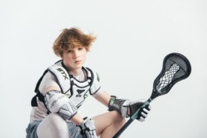 NH lacrosse team & player photography by Leatherhead Sports Media. LAX youth player.