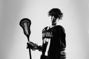 NH lacrosse team & player photography by Leatherhead Sports Media. LAX youth player.