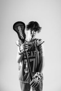 NH lacrosse team & player photography by Leatherhead Sports Media. LAX youth player.