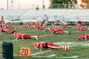 NH highscool youth football photography by Leatherhead Sports Media. Spaulding Red Raiders. Friday night lights.