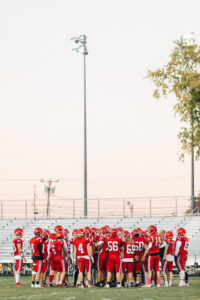 NH highscool youth football photography by Leatherhead Sports Media. Spaulding Red Raiders. Friday night lights.