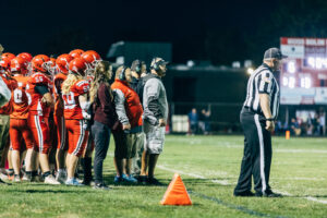 NH highscool youth football photography by Leatherhead Sports Media. Spaulding Red Raiders. Friday night lights.